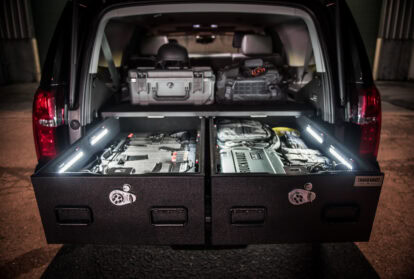 Chevrolet Tahoe with TruckVault drawers open showing gear illuminated by TruckVault LED lights