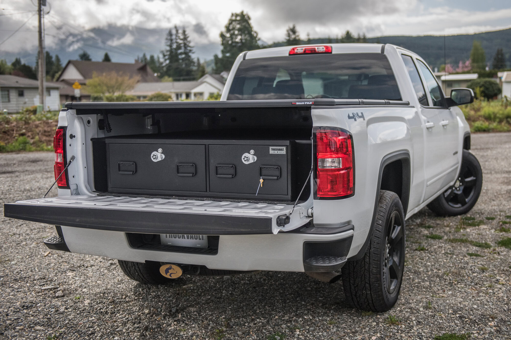 GMC Sierra with a covered bed showcases a close Covered Bed Tw-Drawer TruckVault system