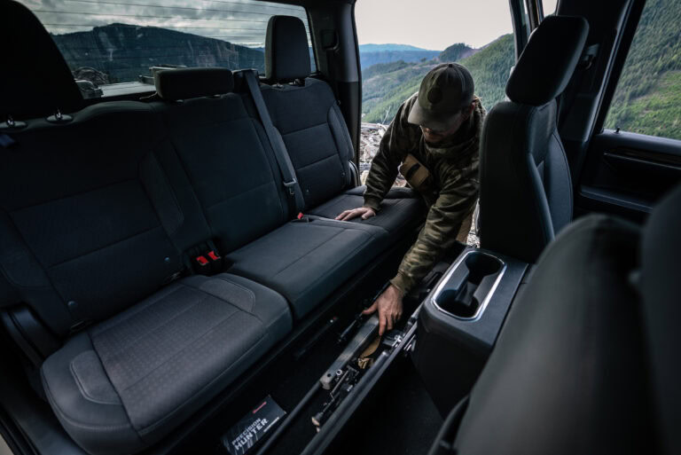 A hunter reaches into his SeatVault Drawer