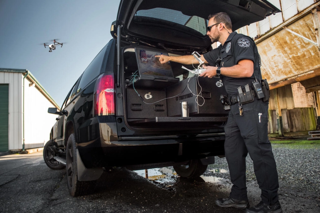 A police officer uses his custom drone build as a command center